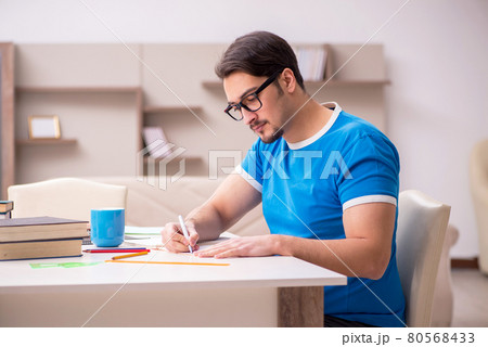 Young male student studying at home 80568433