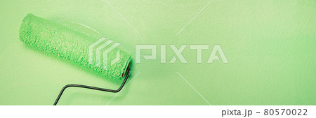 Roller Brush Painting, Worker painting on surface wall Painting apartment, renovating with green color paint. Roller Brush Painting, Worker painting on surface wall Painting apartment, renovating with green color paint. 80570022