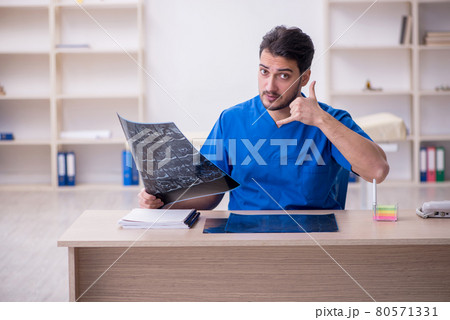 Young male doctor radiologist working in the clinic Young male doctor radiologist working in the clinic 80571331