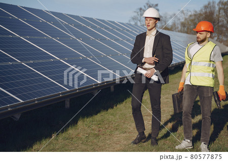 Foreman and businessman at solar energy station. Foreman and businessman at solar energy station. 80577875