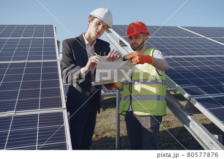 Foreman and businessman at solar energy station. Foreman and businessman at solar energy station. 80577876