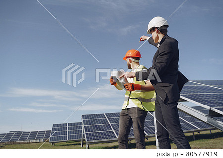 Foreman and businessman at solar energy station. Foreman and businessman at solar energy station. 80577919