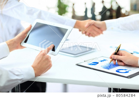 successful contract. handshake on the background of workplace wi 80584284