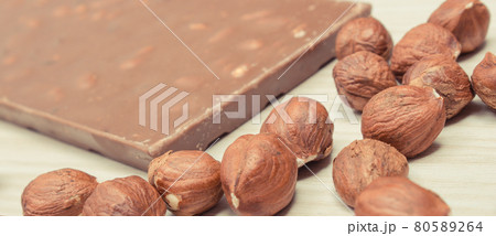 Chocolate with hazelnuts and raisins. Delicious dessert 80589264