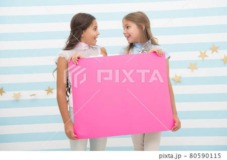 Girl hold announcement banner. Girls kids holding paper Girl hold announcement banner. Girls kids holding paper 80590115