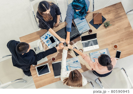 Teamwork business people join hands in meeting. Teamwork business people join hands in meeting. 80590945