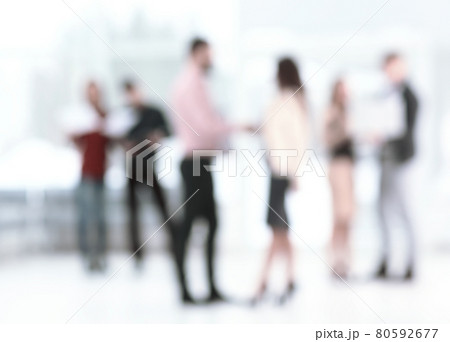 background image of a business team talking in the office hall 80592677