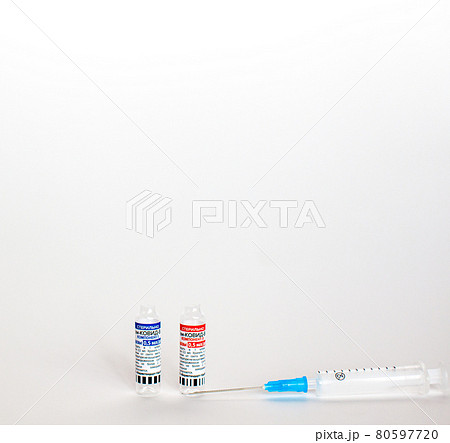 The coronavirus vaccine is in the hands of a doctor, a syringe The coronavirus vaccine is in the hands of a doctor, a syringe 80597720