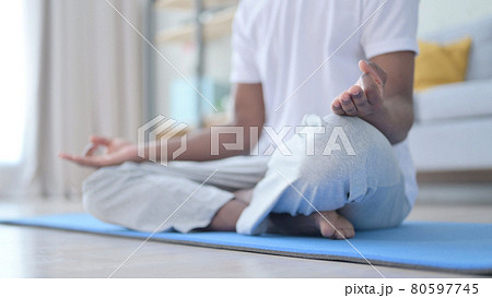 Close up of African Man doing Yoga at Home 80597745