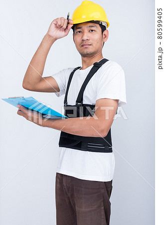 Worker Man stand write book note wearing back support Worker Man stand write book note wearing back support 80599405