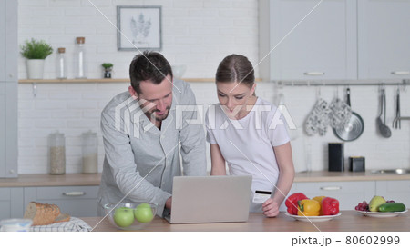 Woman and Man Doing Online Shopping on Laptop Woman and Man Doing Online Shopping on Laptop 80602999