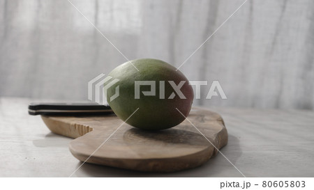 fresh ripe mango on olive board fresh ripe mango on olive board 80605803