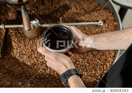 Coffee processing. Roastery, roasting machine and fresh beans Coffee processing. Roastery, roasting machine and fresh beans 80608383
