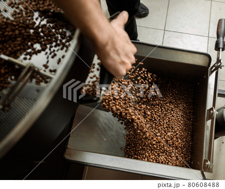 Coffee processing. Roastery, roasting machine and fresh beans 80608488