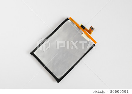 Rechargeable Li-ion battery for smartphone on background. Rechargeable Li-ion battery for smartphone on background. 80609591