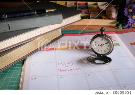 Wording Vaccinaton on calendar with vintage pocket watch ,appiontment for health . Wording Vaccinaton on calendar with vintage pocket watch ,appiontment for health . 80609651