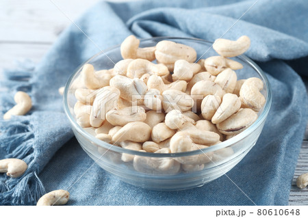 cashew nut in a bowl on table close up cashew nut in a bowl on table close up 80610648