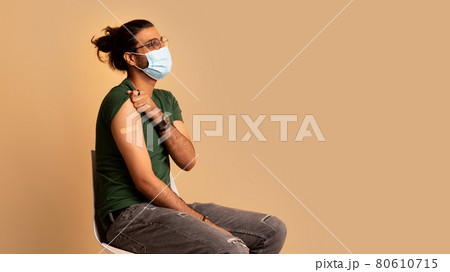 Indian man in face mask got vaccinated, showing shoulder Indian man in face mask got vaccinated, showing shoulder 80610715