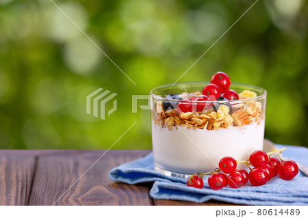 granola with greek yogurt and berries in glass 80614489