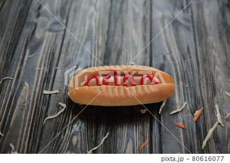 hotdog and cabbage slices on wooden background.photo with copy space hotdog and cabbage slices on wooden background.photo with copy space 80616077