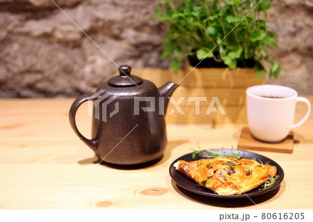 tea cup and salty patty. salty butter scone for a snack 80616205