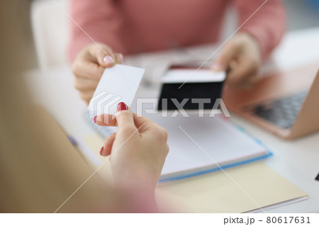 Female hand give blank calling card visitor closeup Female hand give blank calling card visitor closeup 80617631