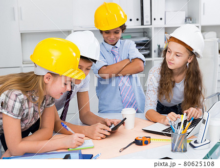 Boys and girls architects with plan 80625108