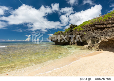 Gorgeous paradise beach, crystal clear sea, coastal rocks, blue sky full of scattered clouds. Iriomote Island. 80626706