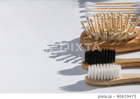 Set of eco natural bathroom accessories and cosmetics on white background. Zero waste. Plastic free. Swabs, toothbrush, ear sticks 80629475