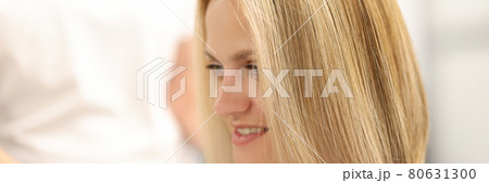 Portrait of woman with new haircut and hair coloring in beauty salon Portrait of woman with new haircut and hair coloring in beauty salon 80631300