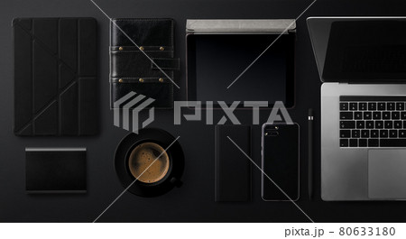 Flat lay top view office desk working space with laptop on black background. 80633180