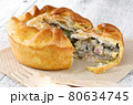 Close up of chicken and mushroom pie on a wooden table 80634745