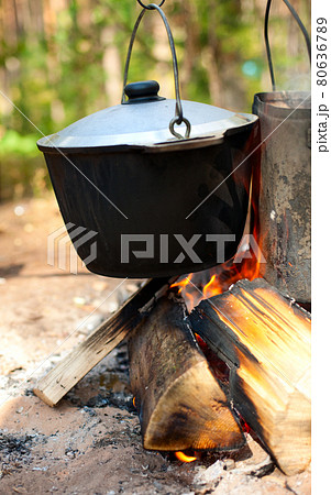 Kettles over campfire 80636789
