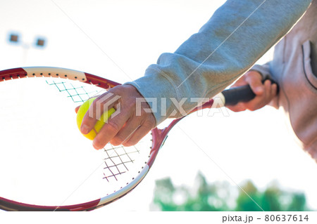 Senior man playing tennis against clear sky on sunny day Senior man playing tennis against clear sky on sunny day 80637614