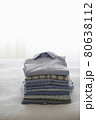 Ironed And Folded Shirts On Bed 80638112
