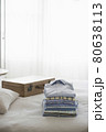 Ironed And Folded Shirts On Bed 80638113