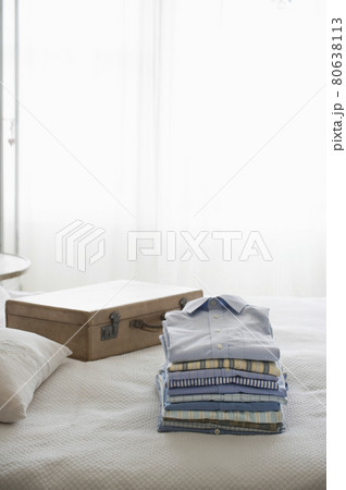Ironed And Folded Shirts On Bed Ironed And Folded Shirts On Bed 80638113