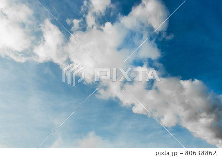 Environmental pollution, smoke coming from the chimney of an industrial plant against a blue sky Environmental pollution, smoke coming from the chimney of an industrial plant against a blue sky 80638862