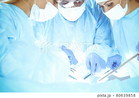 A group of surgeons is operating at the hospital. Health care concept 80639858