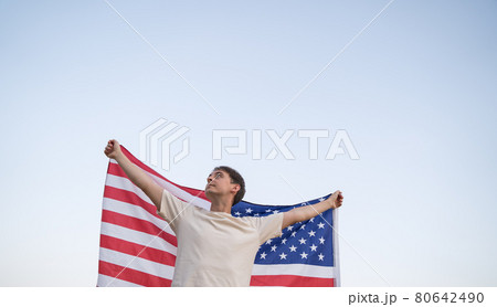 US Independence. Activist with the national flag of America in the sky US Independence. Activist with the national flag of America in the sky 80642490