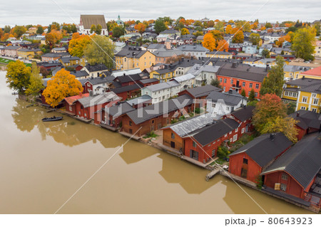 Aerial autumn view of Old town of Porvoo, Finland. Beautiful city landscape with idyllic river Porvoonjoki, old colorful wooden buildings and Porvoo Cathedral. 80643923