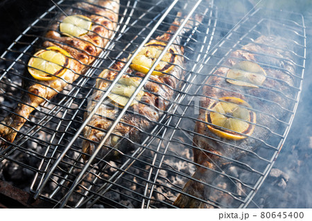 Grilling dorada fish on grill Grilling dorada fish on grill 80645400