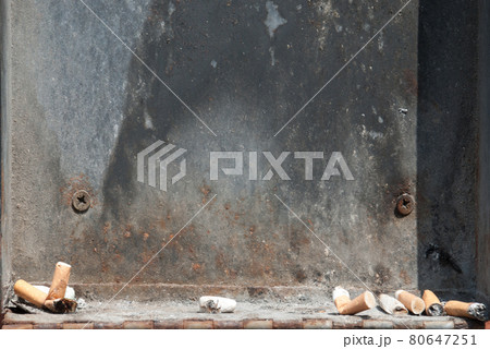 Cigarette butts and ashtrays. 80647251