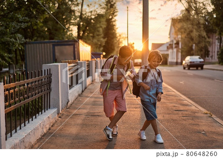 School boys running to school. School boys having fun after school. School boys running to school. School boys having fun after school. 80648260