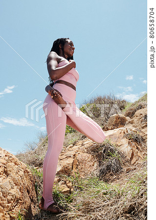 Sportswoman Balacning on One Leg 80658704