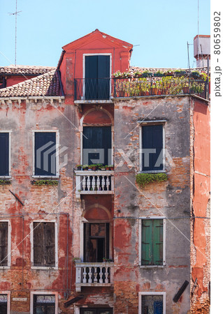 Old venetian building. Red brick walls Old venetian building. Red brick walls 80659802