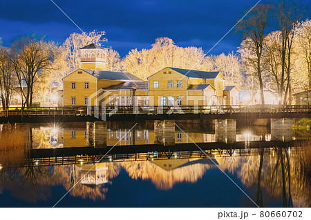 Kuressaare, Estonia. Old Traditional Yellow Wooden House In Evening Blue Hour Night Kuressaare, Estonia. Old Traditional Yellow Wooden House In Evening Blue Hour Night 80660702
