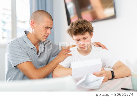 Father and son have recieved letter Father and son have recieved letter 80661574