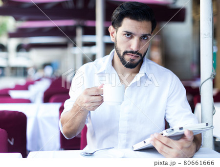 Young man resting on summer terrace cafe 80661666