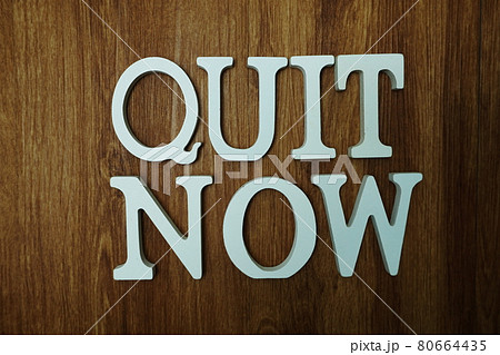 Quit Now word alphabet letters on wooden background 80664435
